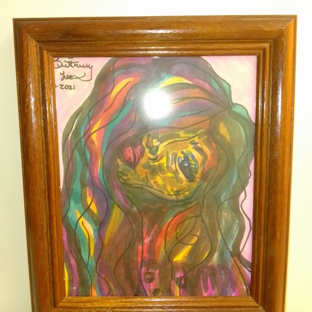 Wall art in a solid wood frame. Signed and sealed.